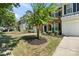Charming townhome with a well-maintained lawn, mulch beds, and an attached garage at 140 N Arcadian Way, Mooresville, NC 28117