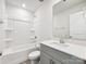 Bathroom featuring tub, shower, single sink vanity with gray cabinets, and neutral walls at 1411 Windy Park Dr, Stanley, NC 28164