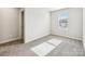 Bright bedroom with a window, neutral walls, carpeted flooring, and a closet at 1411 Windy Park Dr, Stanley, NC 28164