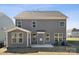 The house features a large backyard, patio and gray siding at 15238 Ravenall Dr, Huntersville, NC 28078
