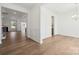 Bright foyer boasts hardwood floors, white trim, and an open concept living space at 15238 Ravenall Dr, Huntersville, NC 28078