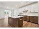 Stylish kitchen features an island, stainless steel appliances, and white cabinetry at 15238 Ravenall Dr, Huntersville, NC 28078
