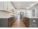 Gourmet kitchen with stainless appliances, center island, and white subway tile backsplash at 15238 Ravenall Dr, Huntersville, NC 28078