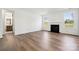 Spacious living room featuring a cozy fireplace, hardwood floors, and ample natural light at 15238 Ravenall Dr, Huntersville, NC 28078