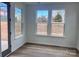 Bright sun room with hardwood floors and abundant natural light at 15238 Ravenall Dr, Huntersville, NC 28078