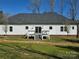 Backyard featuring a neutral colored home, spacious yard, and private deck at 1934 Hollybrook Ln, Lancaster, SC 29720