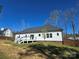 Home's backyard features a spacious yard with a deck to enjoy the outdoors at 1934 Hollybrook Ln, Lancaster, SC 29720