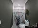 Cozy bathroom featuring a novelty shower curtain at 1934 Hollybrook Ln, Lancaster, SC 29720