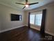 Spacious bedroom featuring natural light, dark wood floors, and a ceiling fan at 1934 Hollybrook Ln, Lancaster, SC 29720
