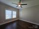 Bright bedroom featuring a ceiling fan and large window offering ample natural light at 1934 Hollybrook Ln, Lancaster, SC 29720