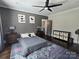 Relaxing bedroom with modern decor, wood-look floors, and a cozy atmosphere at 1934 Hollybrook Ln, Lancaster, SC 29720