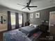 Comfortable bedroom with a ceiling fan, natural light, and stylish furnishings at 1934 Hollybrook Ln, Lancaster, SC 29720