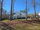 Inviting single-story home surrounded by lush trees, offering a serene and private setting at 1934 Hollybrook Ln, Lancaster, SC 29720