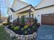 Charming front porch with swing, complemented by beautiful landscaping and a well-maintained exterior at 1934 Hollybrook Ln, Lancaster, SC 29720
