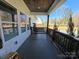 Covered front porch with a charming swing, offering a relaxing outdoor space with views of the surrounding neighborhood at 1934 Hollybrook Ln, Lancaster, SC 29720