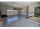 Garage features storage, epoxy flooring, stairs, and an insulated garage door at 1934 Hollybrook Ln, Lancaster, SC 29720