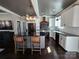 Modern kitchen with stainless steel appliances, black countertops, and stylish island seating at 1934 Hollybrook Ln, Lancaster, SC 29720
