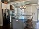 Stylish kitchen with a central island, ample cabinet space, and modern lighting fixtures at 1934 Hollybrook Ln, Lancaster, SC 29720