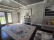 Bright living area with patio access, showcasing hardwood floors and stylish decor at 1934 Hollybrook Ln, Lancaster, SC 29720