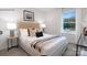 Comfortable bedroom featuring neutral tones, a large window and stylish furnishings at 208 Parker Claire Ln, Kings Mountain, NC 28086