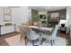 Bright dining room with elegant table and chairs, connecting to a cozy living area at 208 Parker Claire Ln, Kings Mountain, NC 28086