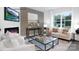 Cozy living room with a fireplace, stylish furniture, and plenty of natural light at 208 Parker Claire Ln, Kings Mountain, NC 28086