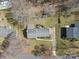 Aerial view of a home showcasing its landscaped yard and neighborhood setting at 211 Kingsway Cir, Charlotte, NC 28214