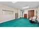 Spacious basement area featuring a rocking chair, closet, and neutral walls and ceiling at 211 Kingsway Cir, Charlotte, NC 28214