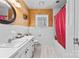 Bathroom with wood paneling, white tile, and a pink shower curtain at 211 Kingsway Cir, Charlotte, NC 28214