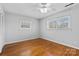 Bright bedroom with hardwood floors, neutral walls, and plenty of natural light at 211 Kingsway Cir, Charlotte, NC 28214