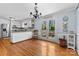 Bright dining area next to the kitchen with hardwood floors and views to the deck at 211 Kingsway Cir, Charlotte, NC 28214