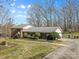 Spacious brick home with a well-kept yard and long driveway at 211 Kingsway Cir, Charlotte, NC 28214