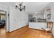 Spacious kitchen featuring white cabinets, stainless steel appliances, and hardwood flooring at 211 Kingsway Cir, Charlotte, NC 28214