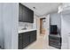 Kitchenette in basement with dark cabinets and white countertops at 211 Kingsway Cir, Charlotte, NC 28214