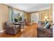 Comfortable living room with natural light, hardwood flooring, and classic interior design at 211 Kingsway Cir, Charlotte, NC 28214