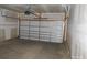 Spacious two car garage with a white garage door at 212 Sugar Hill Rd, Troutman, NC 28166