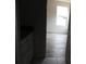 Hallway with white cabinets and granite countertops, leading into a bedroom at 212 Sugar Hill Rd, Troutman, NC 28166