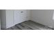 This room boasts built-in storage cabinets with luxury vinyl plank flooring and fresh white paint at 212 Sugar Hill Rd, Troutman, NC 28166