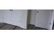 A row of built-in storage cabinets and a door are pictured on luxury vinyl plank flooring at 212 Sugar Hill Rd, Troutman, NC 28166