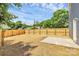 The spacious backyard features a wooden privacy fence and a small concrete patio at 230 Georgia Sw St, Concord, NC 28025