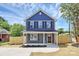 Charming two-story home featuring a covered front porch and newly landscaped front yard at 230 Georgia Sw St, Concord, NC 28025