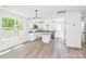 Bright, modern kitchen featuring an island, white cabinets, and contemporary finishes at 230 Georgia Sw St, Concord, NC 28025