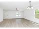 Open-concept living room featuring a blend of natural light and modern design at 230 Georgia Sw St, Concord, NC 28025