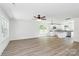Bright open-concept living space featuring modern floors, windows, and kitchen area at 230 Georgia Sw St, Concord, NC 28025