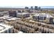 A Charlotte, NC, neighborhood aerial view with office buildings and townhomes at 243 Lincoln St, Charlotte, NC 28203