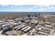 A vast aerial view displays Charlotte's urban landscape with trees and buildings in the background at 243 Lincoln St, Charlotte, NC 28203