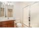 Bathroom features a single vanity sink and a stand up glass shower at 243 Lincoln St, Charlotte, NC 28203