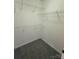 Walk-in closet with carpet floors and metal shelving at 243 Lincoln St, Charlotte, NC 28203
