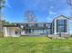 Gorgeous backyard with an expansive lawn overlooking the house at 2536 Brawley School Rd, Mooresville, NC 28117