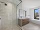 Modern bathroom featuring a glass shower, double vanity, and soaking tub at 2536 Brawley School Rd, Mooresville, NC 28117